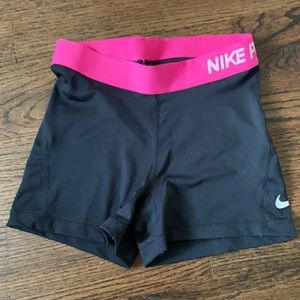 Pink and black nike pro shorts